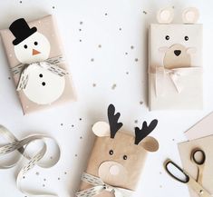 some wrapping paper with reindeer and snowman on them