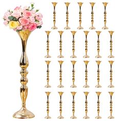 a tall gold vase filled with lots of pink and yellow flowers next to each other