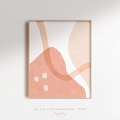 a pink and white abstract art piece hanging on the wall