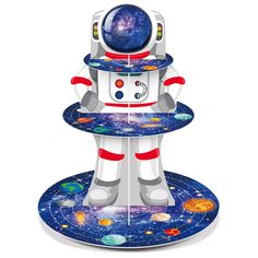 a paper model of an astronaut holding a tray with planets on it