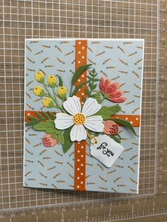 a close up of a card with flowers on it