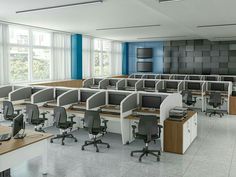 an empty office with desks and chairs