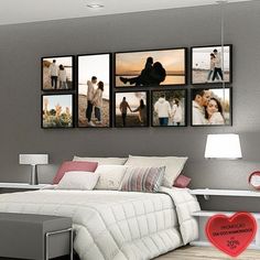 a bedroom with pictures hanging on the wall and a bed in front of it,