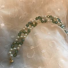 Pearl Bracelet: Cream Swarovski Pearls and Moss Green Czech | Etsy Elegant Green Pearl Bracelet, Elegant Green Beaded Pearl Bracelet, Elegant Pearl Bracelet With Faceted Beads, Green Beaded Pearl Bracelets, Elegant May Birthstone Beaded Bracelets With Faceted Beads, Elegant May Birthstone Faceted Beaded Bracelets, Elegant Green Beaded Bracelets With Faceted Beads, Green Pearl Beaded Bracelets, Green Round Bead Bracelets For Wedding