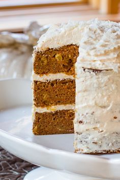 a piece of carrot cake on a white plate