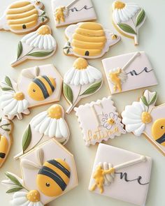 decorated cookies with bees and flowers on them