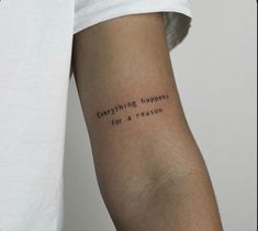 a person with a tattoo that says everything happens for a reason on their left arm