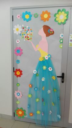 a door decorated with paper flowers and a woman holding a flower in her hand,