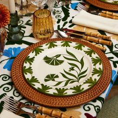 a table set with place settings and utensils