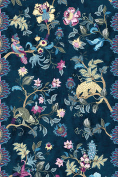 a blue rug with flowers and birds on it