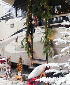 an rv decorated for christmas with wreaths and lights