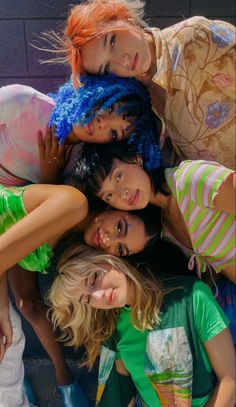 a group of young women standing next to each other