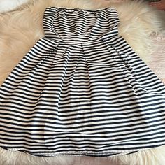 Blue And White Striped A-Line Dress With Pleats Striped Strapless Dress For Party, Casual Strapless Striped Dress, Casual Striped Strapless Dress, Striped Strapless Party Dress, Spring Striped Strapless Dress, Chic Striped Strapless Dress, Dress With Pleats, White Striped Dress, Striped Dress