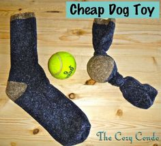 a pair of socks and a tennis ball on a wooden table with the words cheap dog toy