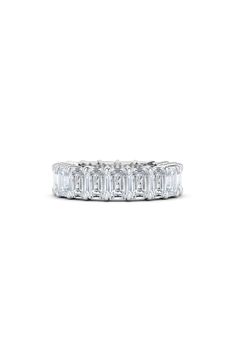 Dial up the drama by bringing on the brilliance wearing this eternity band set with 21 emerald-cut diamonds. This ring features ethically sourced diamonds that are created in a lab and are chemically identical to mined gems. Total diamond weight: 4.60ct. Color: D-F Clarity: VS 18k gold/lab-created diamond Made in the USA Diamond Guide Eternity Band Set, Gold Eternity Band, Diamond Guide, White Gold Band, The Drama, Emerald Cut Diamonds, Eternity Band, Lab Created Diamonds, Eternity Bands