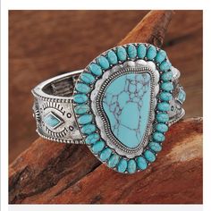 Conchos Around The Band Pop With Faux-Turquoise Stones 21/2" Wide At Center Stretches To Fit Most Wrists Adjustable Bohemian Turquoise Ring For Festivals, Bohemian Adjustable Turquoise Ring For Festivals, Western Style Blue Cuff Bracelet Gift, Adjustable Southwestern Blue Cuff Bracelet, Southwestern Style Blue Bangle Bracelets, Southwestern Style Blue Bangle Bracelet, Southwestern Style Blue Concho Jewelry, Southwestern Blue Concho Jewelry, Western Style Blue Cuff Bangle Bracelet