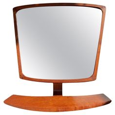 a wooden mirror sitting on top of a stand