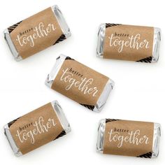 four personalized chocolates wrapped in brown paper with the words together on each wrapper