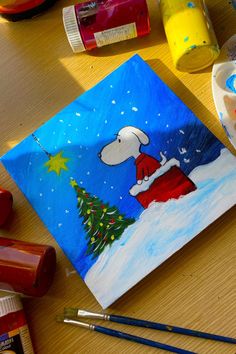 Christmas painting on canvas with Snoopy wearing a red sweater, sitting near a Christmas tree in the snow. Christmas Painting On Canvas, Christmas Painting, Holiday Painting, Snoopy Christmas