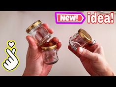 two hands holding glass jars with gold rims and the words new idea above them