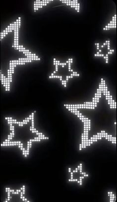 an array of pixelated stars on a black background