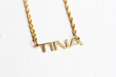 Vintage Name Necklace  Tina by diamentdesigns on Etsy Vintage Personalized Nameplate Necklace, Personalized Vintage Nameplate Necklace, Vintage Custom Name Jewelry Nameplate, Vintage Nameplate Necklaces, Vintage Custom Name Nameplate Jewelry, Vintage Custom Nameplate Jewelry, Vintage Gold Name Necklace, Vintage Nameplate Necklace As Gift, Vintage Nameplate Necklace For Gifts