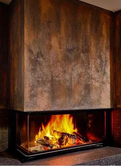 a fireplace that is lit up with flames