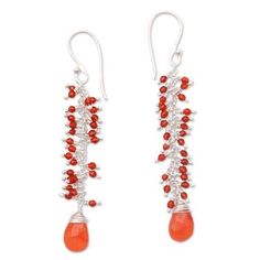 Glittering beautifully with the red-orange hues of the sunset petite carnelian gems are linked together by high-polish sterling silver. Balinese artisan Ketut Sulastri designs these dangle earrings which culminate in carnelian stones that total seven carats. Carnelian Gemstone Dangle Earrings, Orange Carnelian Dangle Earrings, Red Carnelian Teardrop Earrings, Nickel Free Carnelian Dangle Earrings, Nickel-free Carnelian Dangle Earrings, Nickel-free Red Carnelian Earrings, Red Carnelian Gemstone Earrings, Red Carnelian Earrings With Ear Wire, Carnelian Dangle Jewelry With Matching Earrings