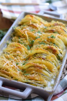 a casserole dish with cheese and parmesan