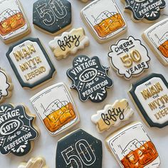 decorated cookies are arranged in the shape of different types of drinks and numbers on them