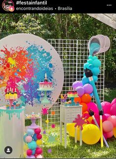 an outdoor party with balloons and decorations