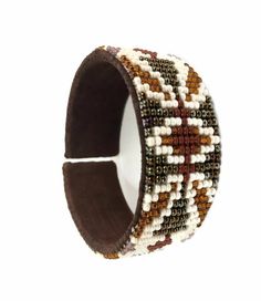 Handmade Beaded Cuff Bracelet.Leather and seed beads where used to create this beautiful black and white bracelet.The cuff bracelet fits everyone. Beaded Hat Bands, Jewelry Casual, Beaded Hat, White Bracelet, Native Beadwork, Beaded Cuff Bracelet, Bead Loom Bracelets, White Bracelets, Bracelet Leather