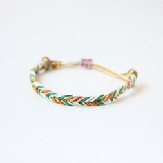 This fishtail braid bracelet from the Boho collection is the perfect transition from summer to fall. Add other bracelets from our boho collection to create a gorgeous stack. All Rally Strings bracelets are available in several sizes and come with an adjustable knot, so you get the perfect fit every time. See our other Special Edition bracelets here: https://etsy.me/38JSrVD Check out all our Rally Strings sets here: www.etsy.com/shop/RallyStrings 🌟 Size and Materials: Bracelets are made using st White Bohemian Braided Friendship Bracelets, Bohemian Green Braided Bracelets, Green Bohemian Braided Bracelet, Multicolor Braided Jewelry For The Beach, Multicolor Braided Jewelry For Beach, White Braided Bohemian Bracelets, White Bohemian Braided Bracelet, Green Braided Bracelets For Summer Festivals, Green Braided Bracelet For Summer Festival