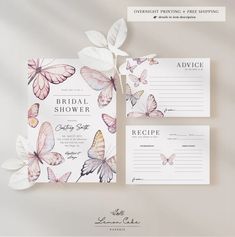 the wedding stationery is decorated with butterflies