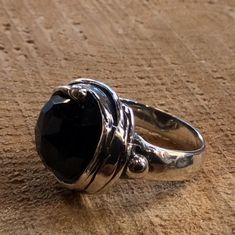 Notorious Wind This sterling silver ring is made with a circular structure. At the center of the bezel sits a rose-cut black onyx gemstone. R1470-11 © 2011-2015 Artisanimpact Inc. All rights reserved. Construction & Dimensions: Materials: sterling silver, onyx Approximate diameter: 20mm (0.8in) We can make any size, including quarter sizes. Please choose your size in the drop down menu, when you check out. About our jewelry Artisanimpact features a variety of brass, silver and 14k gold jewel Unique Black Ring With Oxidized Finish, Unique Black Oxidized Finish Ring, Circular Structure, Gold Schmuck, Oxidized Ring, Organic Rings, Black Onyx Ring, Onyx Gemstone, Ring Black