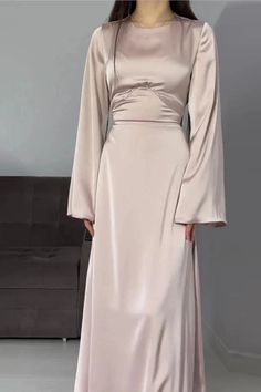 This maxi dress features elegant flare sleeves, an O-neck design, and a chic lace-up detail. Perfect for a stylish and comfortable look. Details: Silhouette: A-LINE Neckline: O-Neck Decoration: none Material: POLYESTER Closure Type: zipper Size (IN) Length Sleeve Bust Waist Hip S 50.4 22.4 32.3 26.0 34.6 M 50.8 22.8 33.9 27.6 36.2 L 51.2 23.2 35.4 29.1 37.8 XL 51.6 23.6 37.0 30.7 39.4 Luxury Long Sleeve Sleek Maxi Dress, Luxury Fitted Maxi-length Puff Sleeve Dress, Luxury Floor-length Maxi Dress With Gathered Sleeves, Luxury Red Long Sleeve Maxi Dress, Elegant Long Sleeve Satin Abaya, Dress Elegant Long, Umbrella Skirt, Flare Sleeves, Grey Maxi Dress