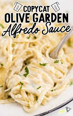 a white plate topped with pasta covered in sauce