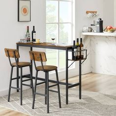 a kitchen table with three stools in front of it