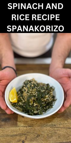 spinach and rice recipe in a white bowl with lemon wedges on the side