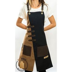 a woman wearing an apron with buttons on the front and side, standing in front of a white background