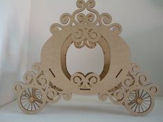 a paper cut out of a horse drawn carriage with ornate designs on the front and sides