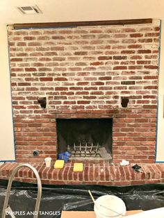 a brick fireplace being installed in a living room