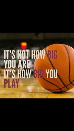 a basketball sitting on top of a wooden floor next to a quote that says it's not how big you are, it's how big you play