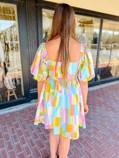 Get ready to turn heads in our Pastel Windowpane Puff Sleeve Dress! With its playful multi color and baby doll style, you'll be the center of attention at any event. The pastel windowpane adds a touch of whimsy to this must-have piece. Don't miss out on this unique dress! Key Features: Bright multi color Puff Sleeves Mini Length Sipper Lined in 90% polyester, 10% spandex Self: 100 Cotton Hand Wash Stylist Review: Model is 5'9" with a 34" bust and a 29" waist and usually wears a medium or large i Fun Multicolor Dresses For Garden Party, Fun Multicolor Dress For Garden Party, Fun Rainbow Dress For Playtime, Fun Rainbow Playtime Dress, Spring Puff Sleeve Playtime Dress, Playful Puff Sleeve Summer Dress, Spring Playtime Puff Sleeve Dress, Puff Sleeve Playtime Dress For Spring, Cute Multicolor Dresses For Playtime