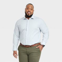 From work meetings to evening outings, stay cool, comfy and stylish in this Performance Dress Long-Sleeve Button-Down Shirt from Goodfellow & Co™. Tailored in a standard fit, this button-down shirt is crafted from a soft fabric blend with a hint of spandex for stretchy comfort. Designed with a collared neckline for classic style, you can wear it tucked in with dress pants or chinos with loafers or dress shoes for a special event, or sport it untucked with jean shorts or chambray pants for a more Casual Dress Shirt With Button Closure For Office, Casual Long Sleeve Dress Shirt For Office, Fall Office Slim Fit Dress Shirt, Casual Collared Dress Shirt For Office, Casual Dress Shirt For Office In Fall, Relaxed Fit Dress Shirt For Office, Casual Fall Dress Shirt For Office, Chambray Pants, Work Meetings