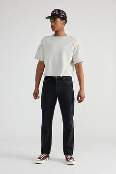 Slim fit jeans from BDG in 14oz. cotton denim. Vintage style silhouette with a straight leg and mid-rise waist. Essential 5-pocket style with a zip fly and button closure. Exclusively at Urban Outfitters. Features Slim fit jeans in rigid denim Straight leg with a mid-rise waist 14oz. denim 5-pocket; zip fly UO exclusive Content + Care 100% Cotton Machine wash Imported Size + Fit Model in White is 6’1" and wearing size 32 Measurements taken from size 32 Rise: 11" Inseam: 28" Leg opening: 7" | BDG Vintage Slim Fit Jean in Onyx at Urban Outfitters Slim Fit Jeans, Mens Bottom, Fit Jeans, Onyx, Mid Rise, Vintage Style, Urban Outfitters, Fitness Models, Full Length