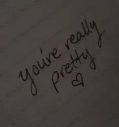 handwriting written on paper with the words you're really pretty