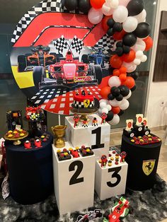 a race car themed birthday party with balloons and table decorations for the first place winner