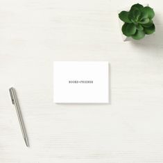 a business card with the word booen - prends on it next to a plant