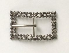 "Victorian Belt Buckle Cut Steel Antique This exquisite antique piece was designed as a victorian sash buckle. This piece is made up of two rows of faceted cut steel riveted beads in round and in moon shapes! The buckle is rectangular in shape with a large shiny metal center pin. This buckle was made in a bowed shape to fit the body. This piece is a true antique with wonderful and delicate craftsmanship! The steel has a natural dark grey patina. This wonderful piece is not marked but looks to be Victorian Belt, Antique Sewing Kit, Antique Belt Buckle, Steel Belt Buckle, Vintage Eye Glasses, Tiaras Jewellery, Silver Belt Buckle, Brass Bracelet, Victorian Jewelry